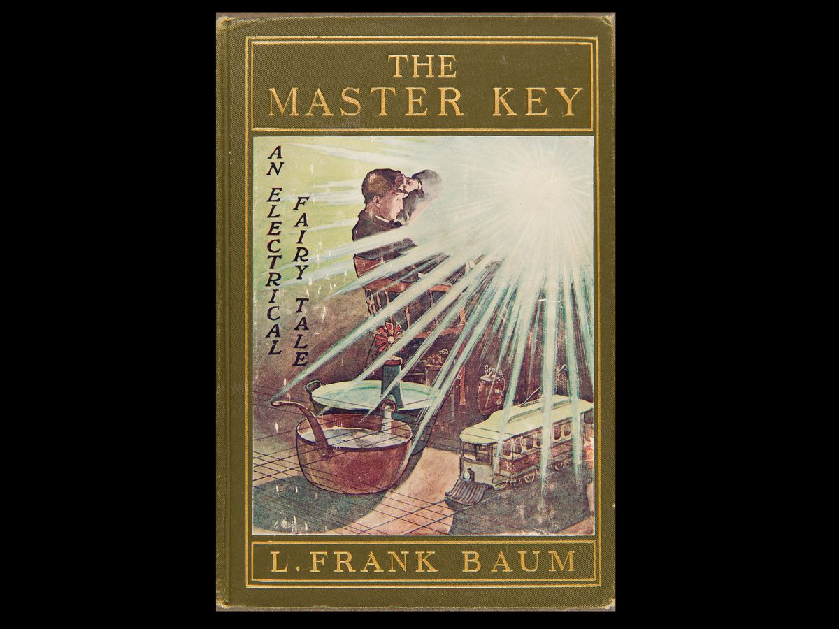 一本名叫《万能钥匙:一个电子童话》的书，作者是l·弗兰克·鲍姆。在封面上，一个男人坐在椅子上，一束强光照向他。