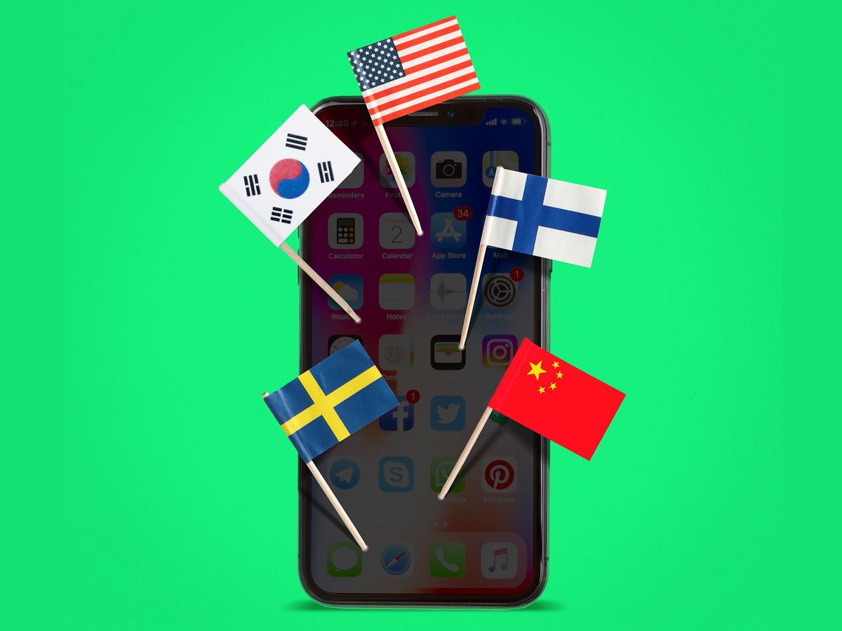 附有多个国家国旗的智能手机的图片说明。
